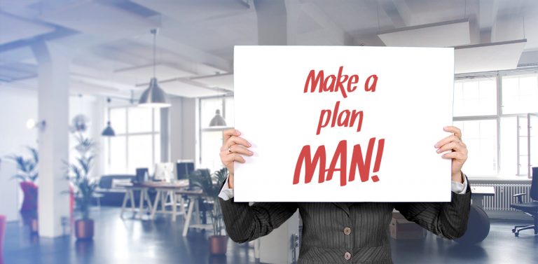 Digital strategies. Woman holding a placard in an oiffce saying "Make a plan Man!"